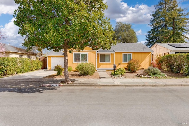 view of front of home featuring driveway and an attached garage