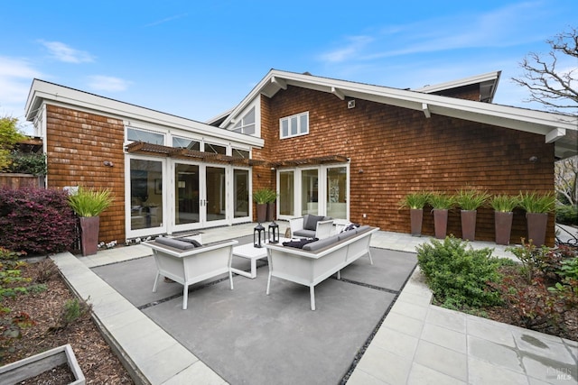 back of house featuring french doors, a patio area, and outdoor lounge area