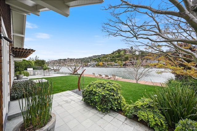 view of patio with a water view