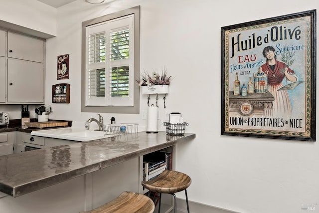 bar featuring a sink