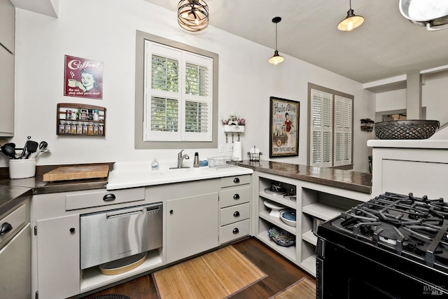 kitchen with dark wood-style floors, pendant lighting, black gas range, and open shelves