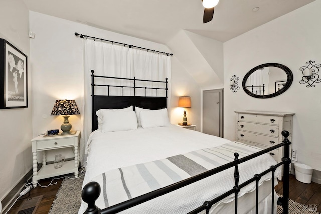 bedroom with lofted ceiling, ceiling fan, baseboards, and wood finished floors