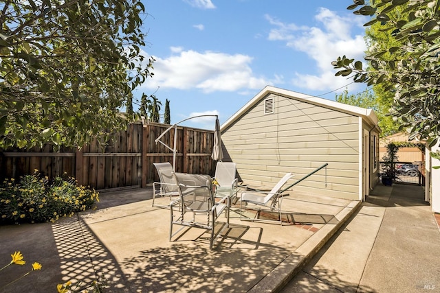 view of patio featuring fence