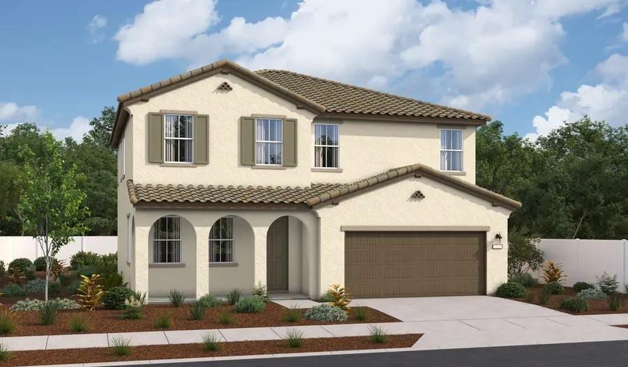 mediterranean / spanish-style house featuring a tiled roof, fence, concrete driveway, and stucco siding