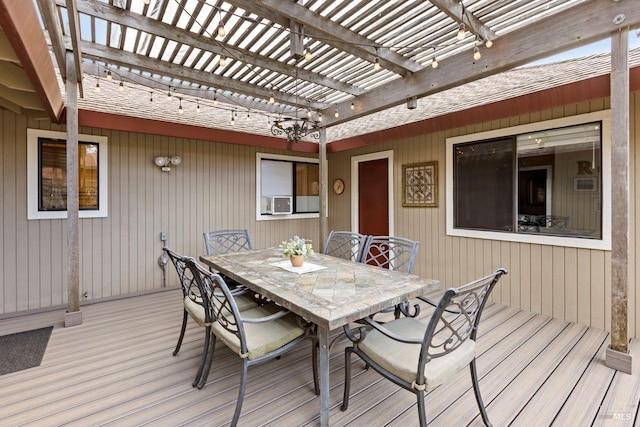 wooden terrace featuring outdoor dining area and a pergola