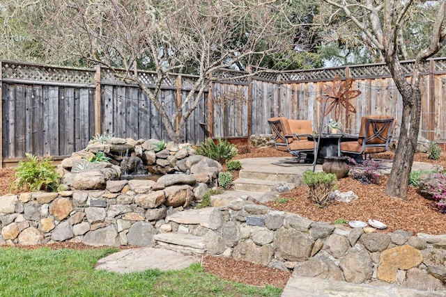 view of yard with a fenced backyard and a patio