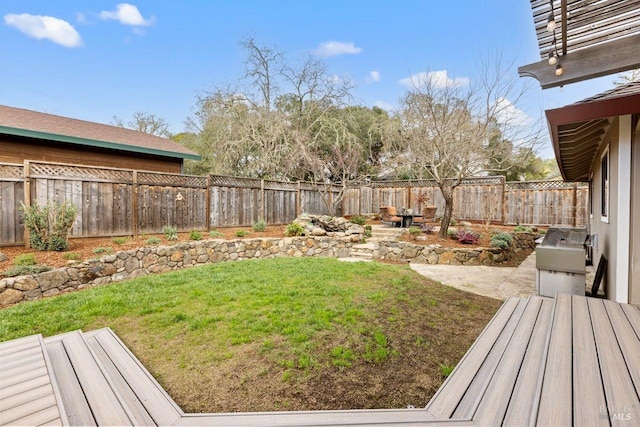 view of yard with a fenced backyard