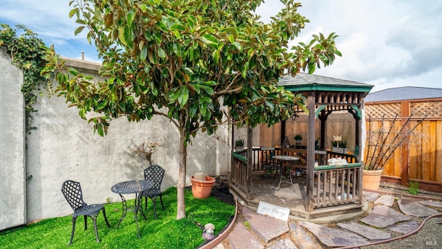 view of patio / terrace featuring a fenced backyard and a gazebo