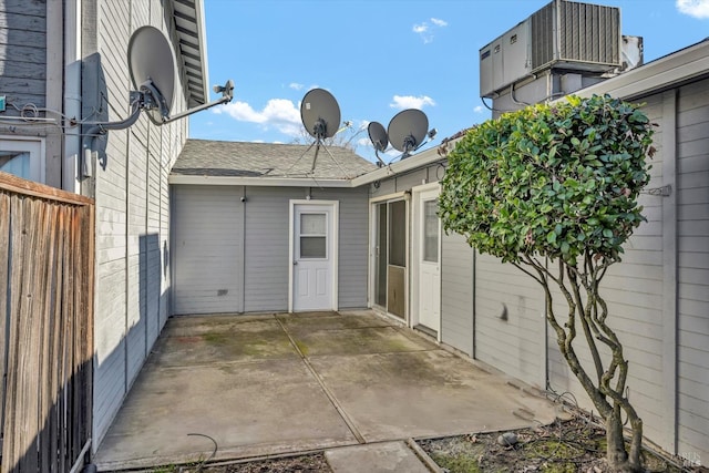 exterior space featuring fence and central air condition unit