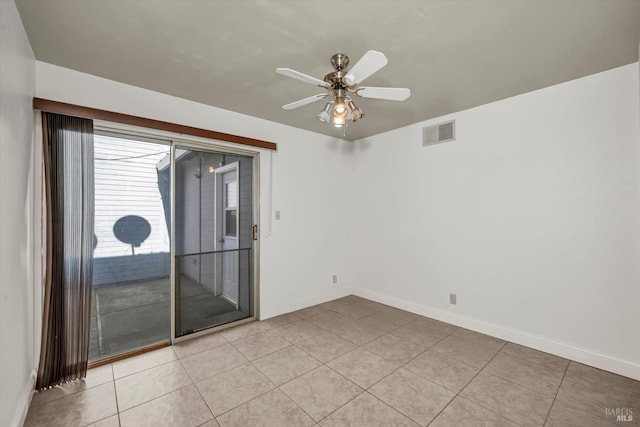 empty room with visible vents, ceiling fan, baseboards, and light tile patterned flooring