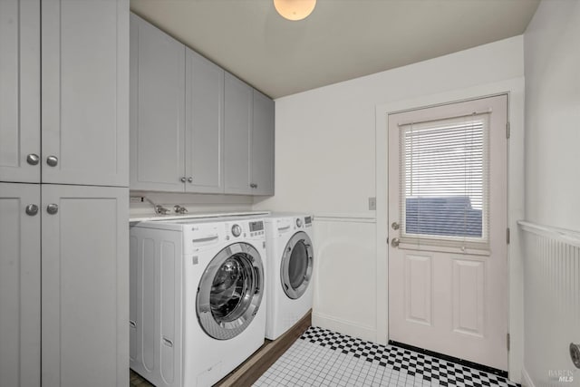 laundry area with washing machine and dryer and cabinet space