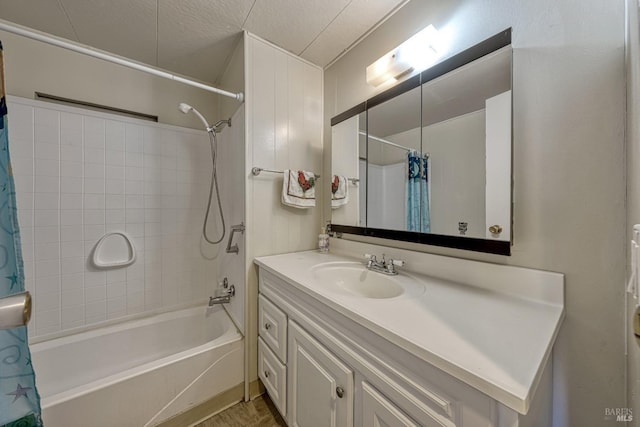 bathroom featuring vanity, a textured ceiling, and shower / bath combo with shower curtain