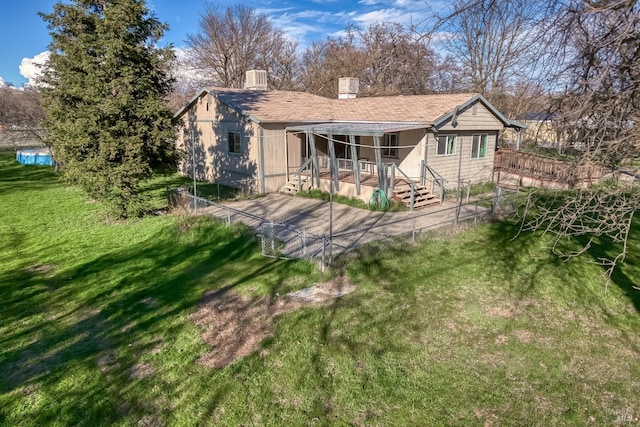 rear view of property with a shingled roof, a lawn, and central air condition unit