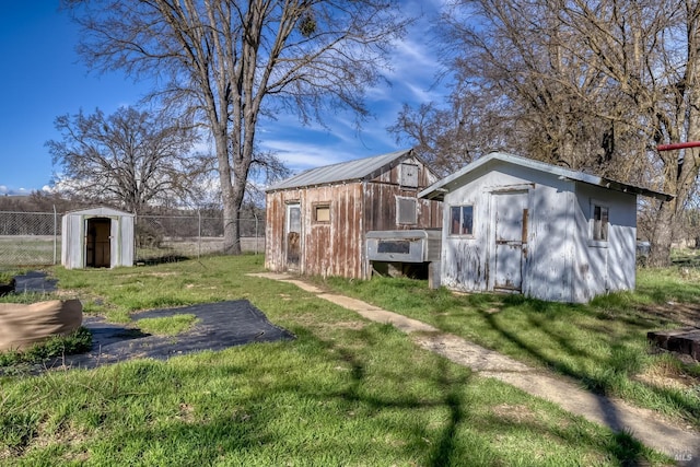 view of shed featuring fence