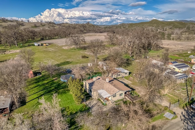 drone / aerial view featuring a rural view and a mountain view