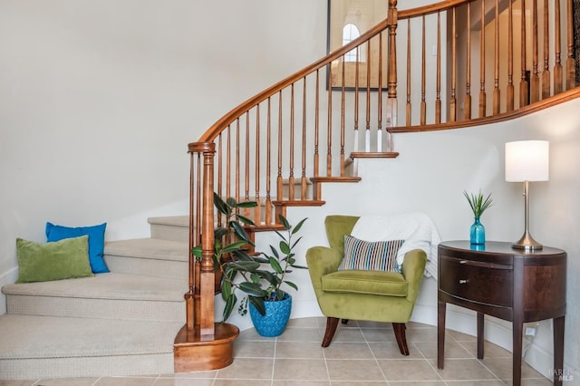 stairway featuring tile patterned flooring