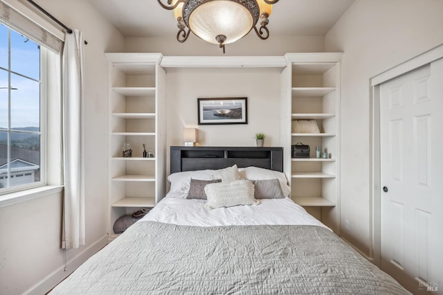 bedroom featuring baseboards