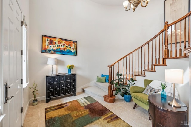 entrance foyer featuring a chandelier, a high ceiling, stairway, and tile patterned flooring