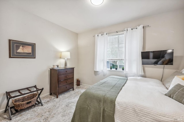 bedroom with carpet floors and baseboards