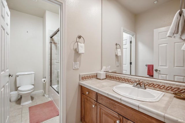 full bathroom with enclosed tub / shower combo, vanity, toilet, and tile patterned floors