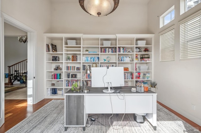 office featuring baseboards and wood finished floors