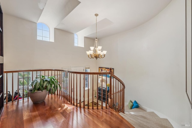 interior space with a chandelier and wood finished floors