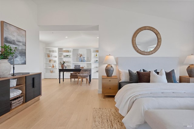 bedroom with recessed lighting, vaulted ceiling, and light wood-style flooring