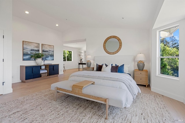 bedroom featuring lofted ceiling, light wood-style flooring, baseboards, and recessed lighting