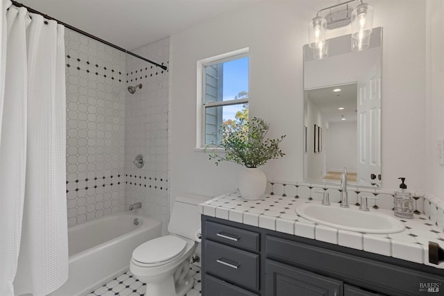 bathroom with vanity, toilet, and shower / bathtub combination with curtain