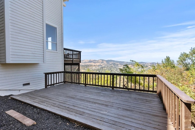 wooden deck featuring a mountain view