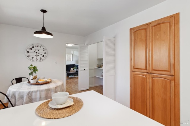 dining space featuring light wood finished floors