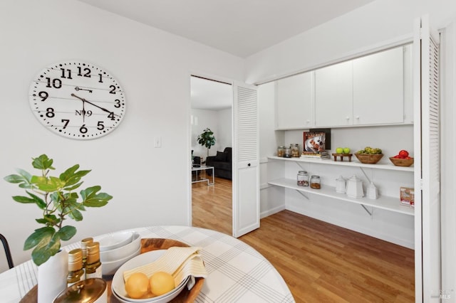 dining area with light wood-style flooring