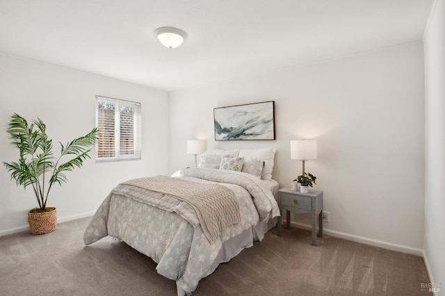 carpeted bedroom featuring baseboards