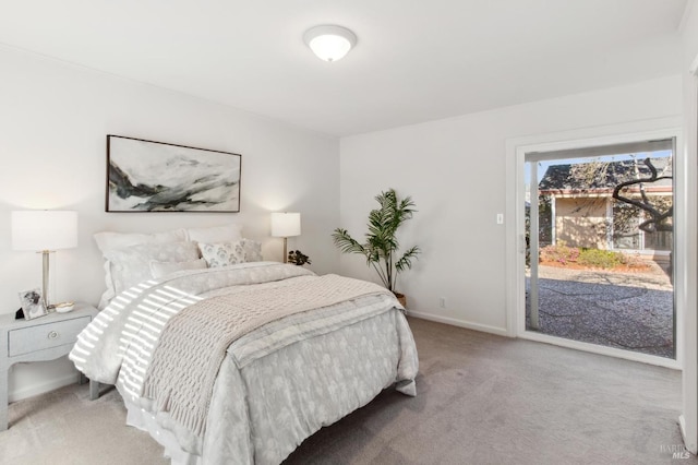 bedroom featuring baseboards, carpet floors, and access to exterior