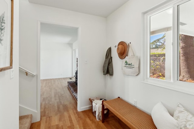 mudroom with light wood-type flooring and baseboards