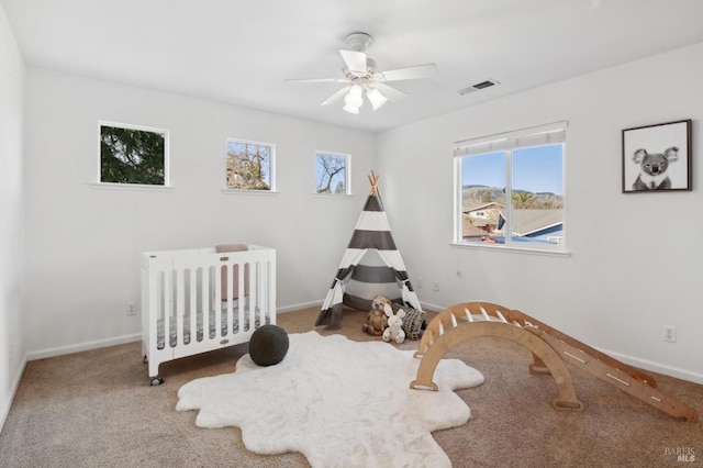 bedroom featuring baseboards, visible vents, and carpet flooring