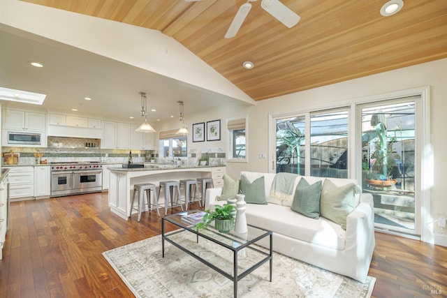 living area with vaulted ceiling, dark wood-style floors, wood ceiling, and a ceiling fan