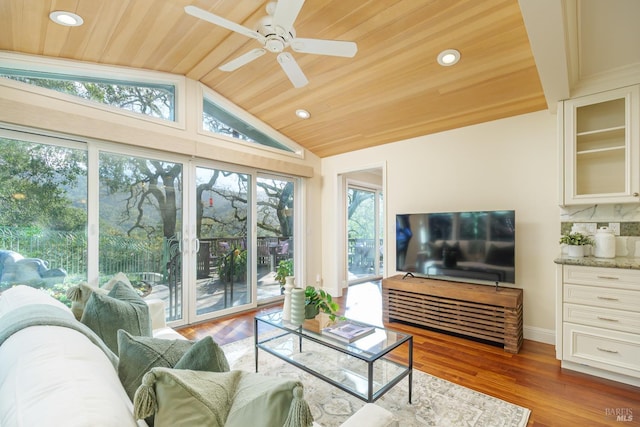 sunroom with wooden ceiling, vaulted ceiling, and ceiling fan