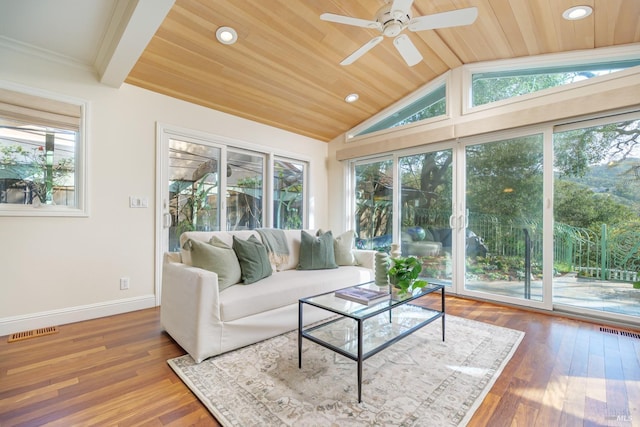 sunroom / solarium featuring vaulted ceiling, ceiling fan, wooden ceiling, and visible vents