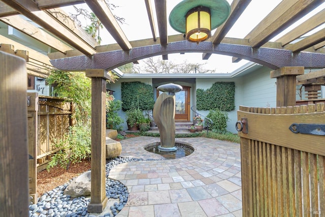 view of patio with fence and a pergola