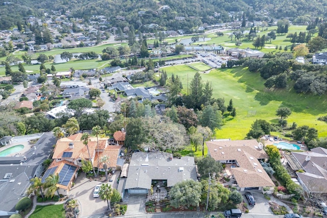 aerial view with a residential view and view of golf course