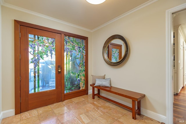 entryway with a healthy amount of sunlight, crown molding, and baseboards