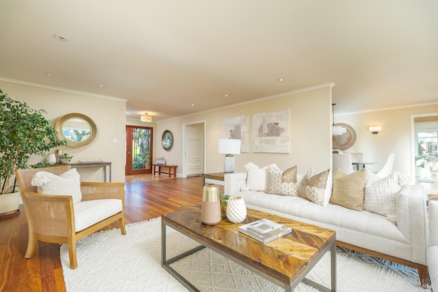 living area featuring light wood-style floors, recessed lighting, and ornamental molding