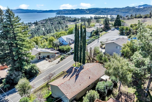 bird's eye view with a water and mountain view