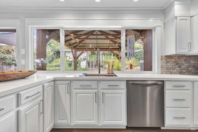 kitchen with dishwasher, light countertops, and plenty of natural light