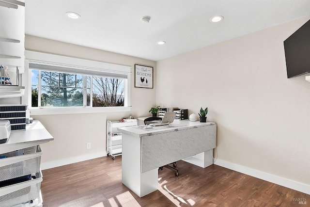 home office with recessed lighting, wood finished floors, and baseboards