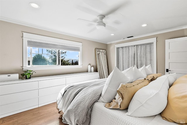 bedroom with ceiling fan, recessed lighting, light wood-style flooring, and crown molding