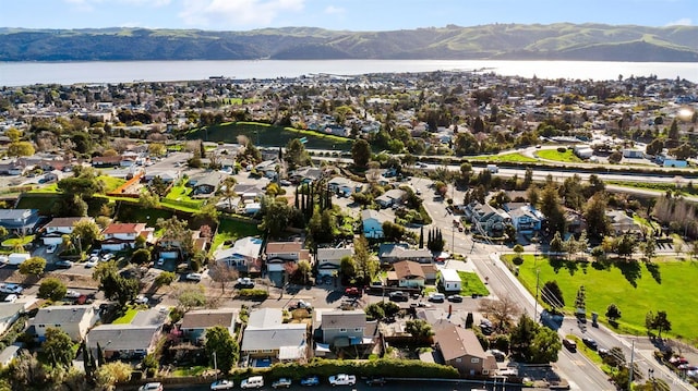 aerial view with a residential view and a water and mountain view