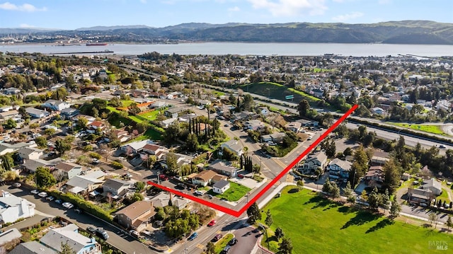 bird's eye view with a residential view and a water and mountain view