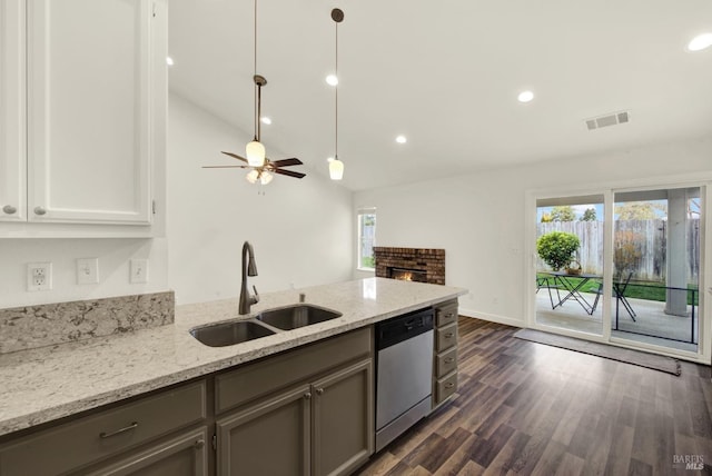 kitchen featuring visible vents, plenty of natural light, dishwasher, and a sink